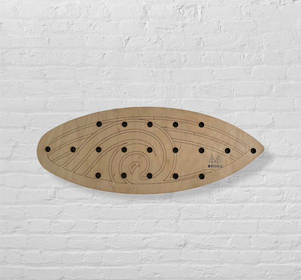 Surf Board Peg Board on a White Brick Wall